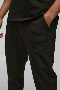 Shop boohooMAN Nylon Technical Stretch Slim Trouser black