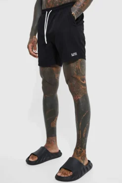 Shop boohooMAN Original Man Mid Length Swim Shorts black