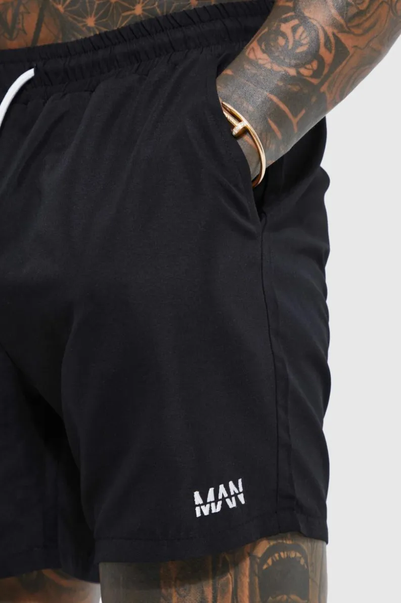 Shop boohooMAN Original Man Mid Length Swim Shorts black