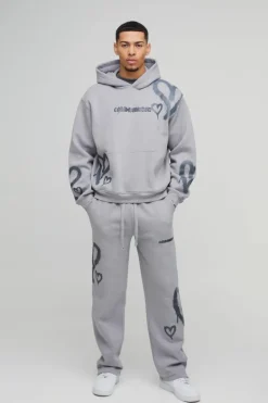 Store boohooMAN Oversized Boxy All Over Heart Printed Hooded Tracksuit grey marl