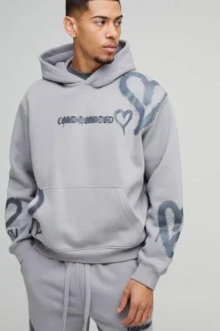 Store boohooMAN Oversized Boxy All Over Heart Printed Hooded Tracksuit grey marl