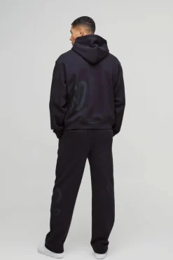 Shop boohooMAN Oversized Boxy All Over Heart Printed Hoodie black