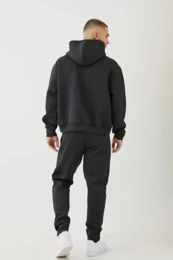 Shop boohooMAN Oversized Boxy Bonded Scuba Hooded Tracksuit black