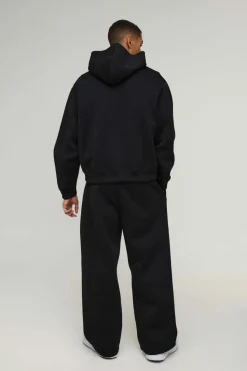 Shop boohooMAN Oversized Boxy Bonded Scuba Hooded Tracksuit black