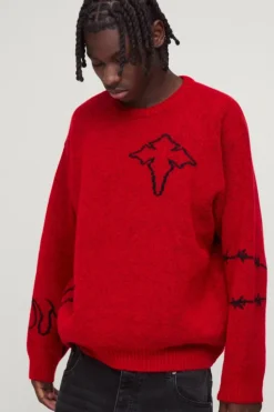 Shop boohooMAN Oversized Boxy Brushed Multi Doodle Graphic Knitted Jumper red