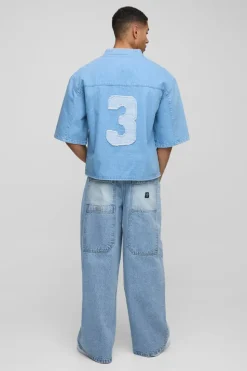 Outlet boohooMAN Oversized Boxy Denim V Neck Applique Football Top light blue