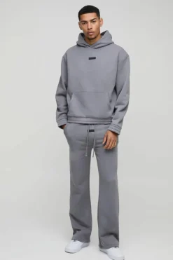Sale boohooMAN Oversized Boxy Flare Stacked Hooded Tracksuit With Rubber Badge charcoal