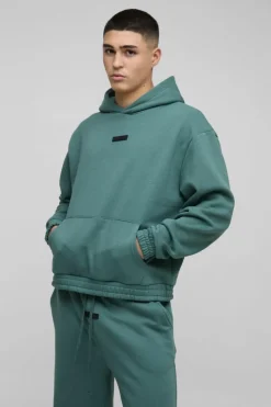 Store boohooMAN Oversized Boxy Flare Stacked Hooded Tracksuit With Rubber Badge forest