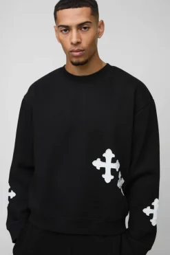 Shop boohooMAN Oversized Boxy Gothic Cross Applique Sweatshirt black