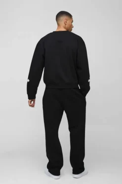Shop boohooMAN Oversized Boxy Gothic Cross Applique Sweatshirt black