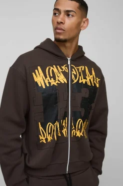 Store boohooMAN Oversized Boxy Graffiti 13 Varsity Zip Through Hooded Tracksuit chocolate