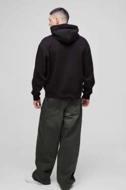 Shop boohooMAN Oversized Boxy Homme PU Applique Hoodie black
