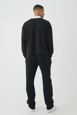 Shop boohooMAN Oversized Boxy Long Sleeve Contrast Polo black