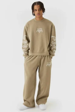 Shop boohooMAN Oversized Boxy Paisley Print Sweatshirt Tracksuit taupe