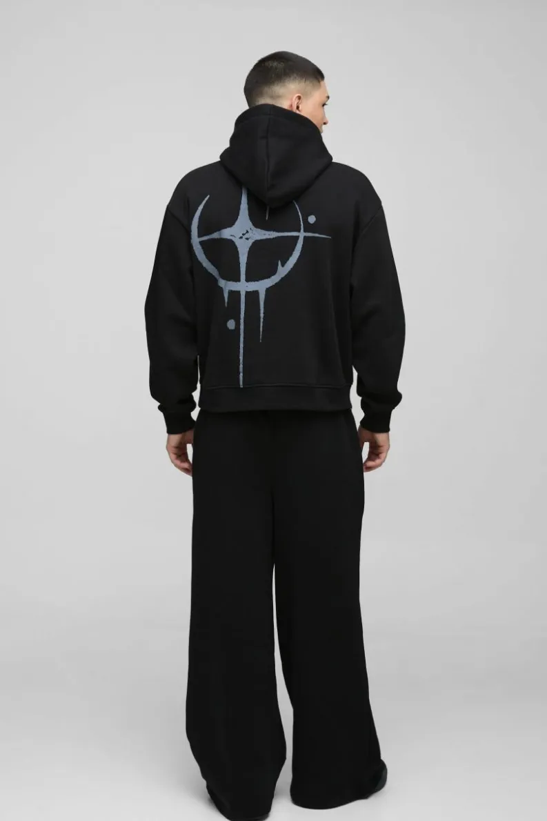Shop boohooMAN Oversized Boxy Star Homme Hoodie black