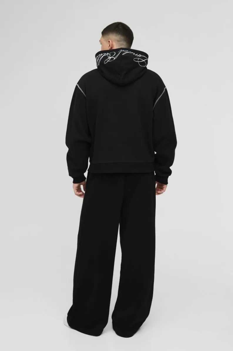 Shop boohooMAN Oversized Boxy Twill Applique Contrast Stitch Hoodie black