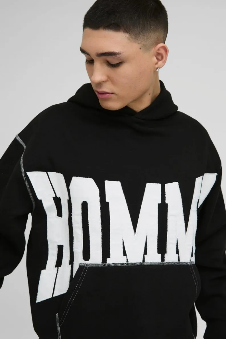 Shop boohooMAN Oversized Boxy Twill Applique Contrast Stitch Hoodie black