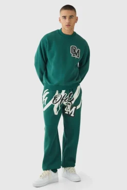 Shop boohooMAN Oversized Boxy Varsity Print Sweatshirt Tracksuit forest