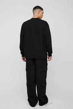 Shop boohooMAN Oversized Cherry Embroidered Sweatshirt black