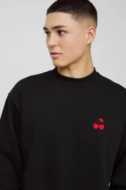 Shop boohooMAN Oversized Cherry Embroidered Sweatshirt black