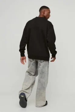 Shop boohooMAN Oversized Cherry Lips Box Graphic Sweatshirt black