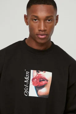 Shop boohooMAN Oversized Cherry Lips Box Graphic Sweatshirt black