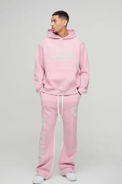 Hot boohooMAN Oversized Cold Hearted Puff Print Gusset Flare Hooded Tracksuit pink