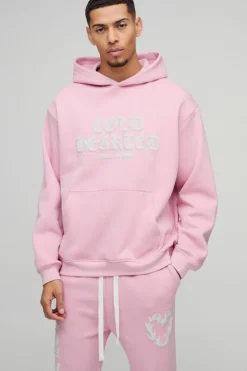 Hot boohooMAN Oversized Cold Hearted Puff Print Gusset Flare Hooded Tracksuit pink