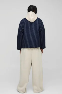 Shop boohooMAN Oversized Collarless Stripe Baseball Varsity Jacket navy
