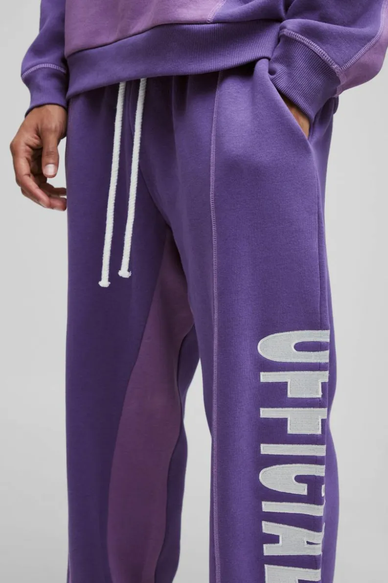 Store boohooMAN Oversized Contrast Stitch Colour Block Official Embroidered Jogger purple