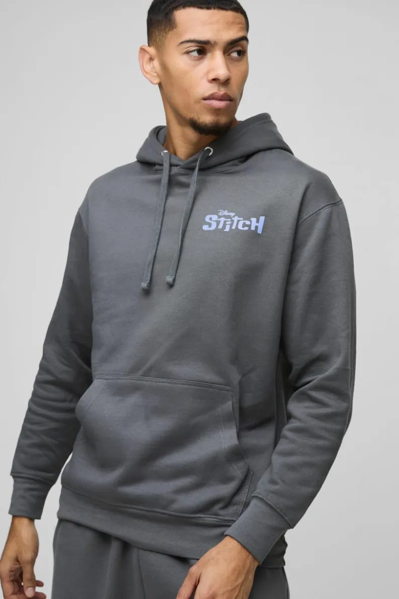 Shop boohooMAN Oversized Disney Lilo and Stitch License Print Hoodie charcoal