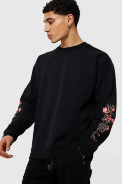 Shop boohooMAN Oversized Dragon Floral Graphic Sweatshirt black
