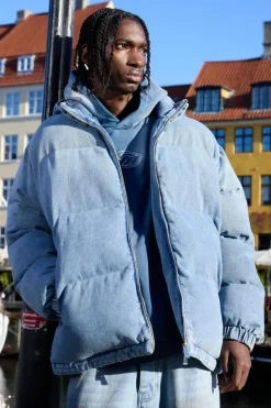 Store boohooMAN Oversized Funnel Neck Detachable Hood Denim Puffer Jacket light blue