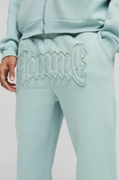 Store boohooMAN Oversized Homme Applique Cuffed Jogger light blue