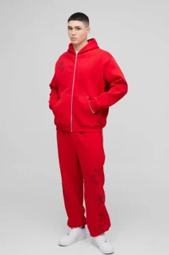 Shop boohooMAN Oversized Life Of The Party Slogan Tracksuit red
