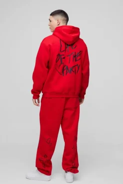 Shop boohooMAN Oversized Life Of The Party Slogan Tracksuit red