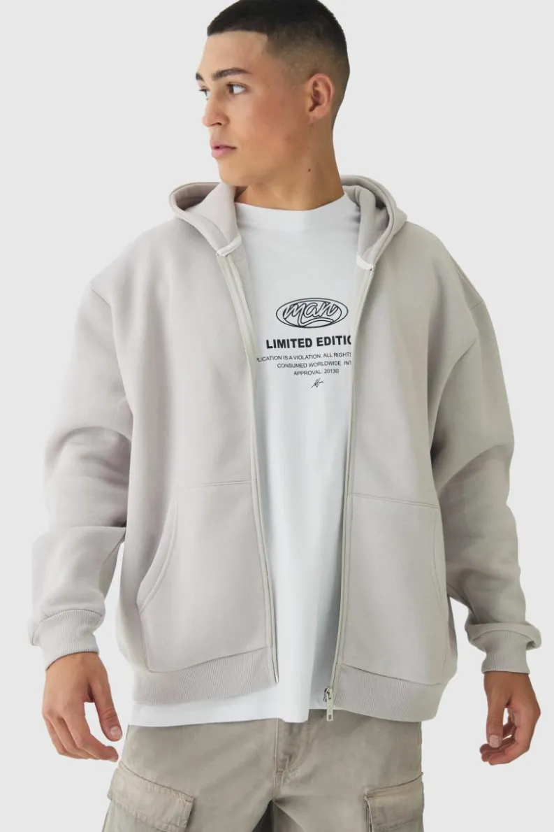 Shop boohooMAN Oversized Official Varsity Embossed Zip Through Hoodie light grey