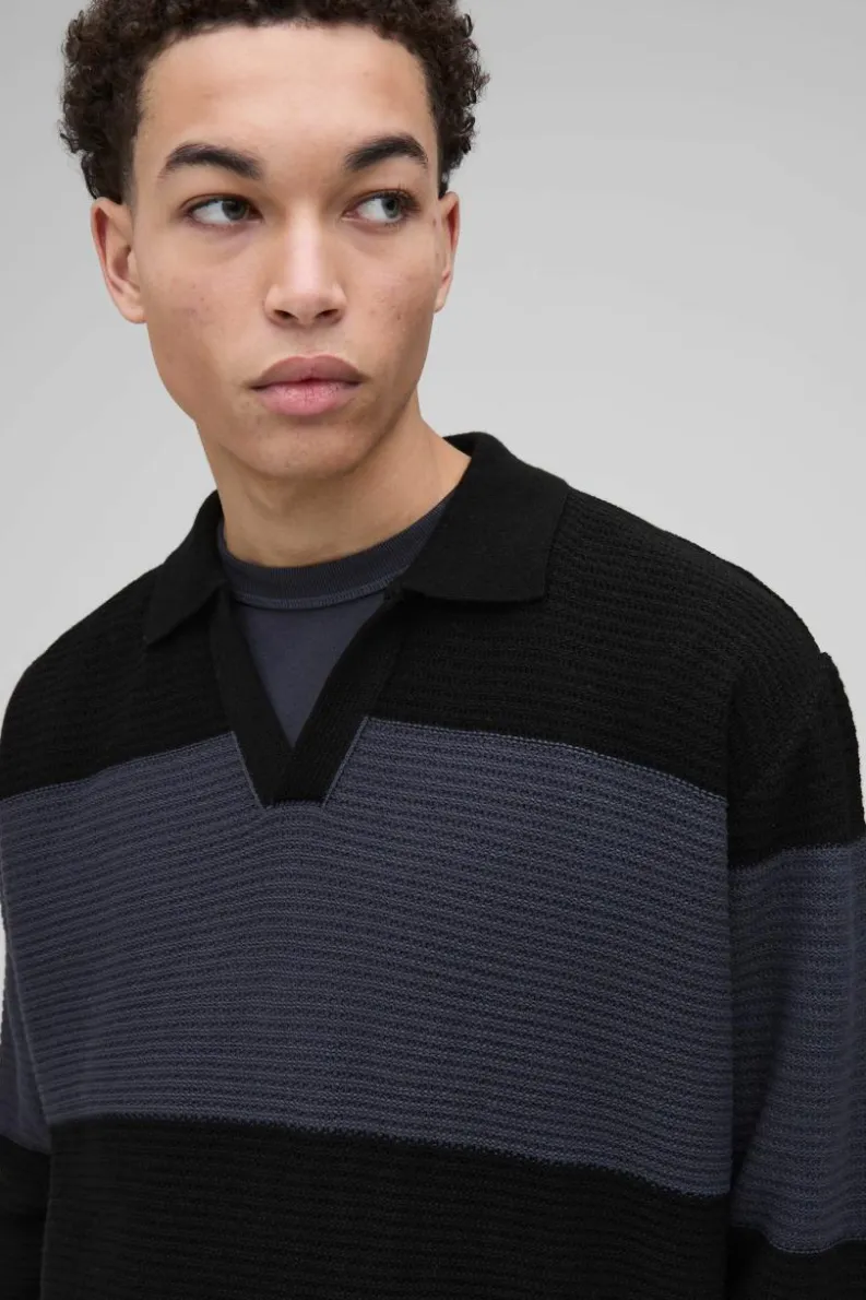 Shop boohooMAN Oversized Ribbed Colour Block Knitted Polo black