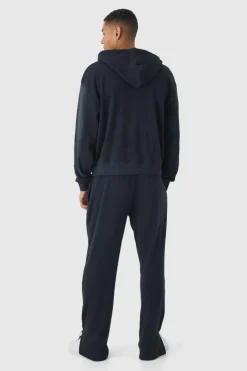 Shop boohooMAN Oversized Spray Wash Heavy Waffle Embroidered Zip Through Hooded Tracksuit black