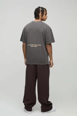 Shop boohooMAN Oversized Sunset Western Puff Print Washed Graphic T-Shirt brown