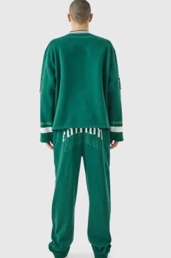Shop boohooMAN Oversized Varsity Applique V Neck Sweatshirt Tracksuit forest