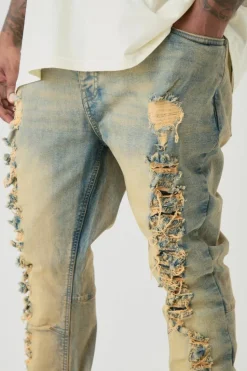 Store boohooMAN Plus Distressed Stretch Skinny Flared Jeans bleach wash
