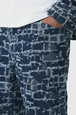 Shop boohooMAN Plus Distressed Tapestry Relaxed Fit Denim Jeans indigo
