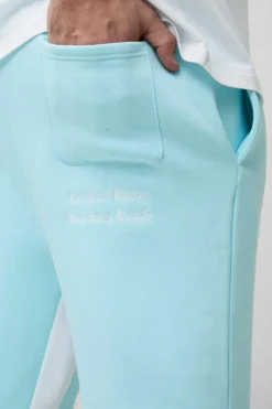 Hot boohooMAN Plus Official Embroidery Relaxed Flare Jogger light blue