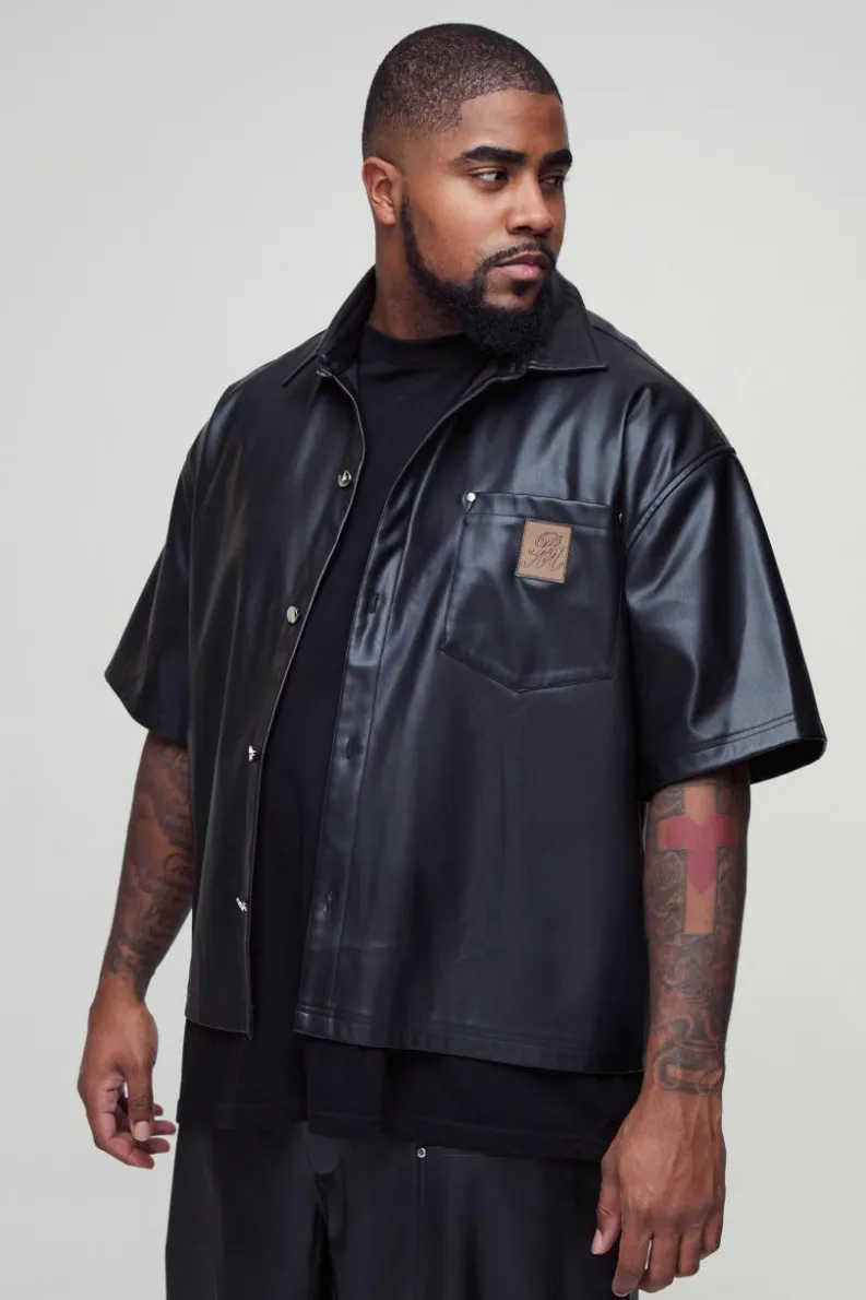 Shop boohooMAN Plus Oversized PU Pocket Detail Shirt black