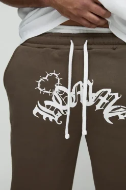 Shop boohooMAN Plus Relaxed Double Waistband Heart Print Jogger brown