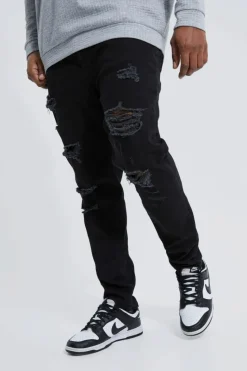 Shop boohooMAN Plus Skinny Stretch All Over Rip Jeans true black