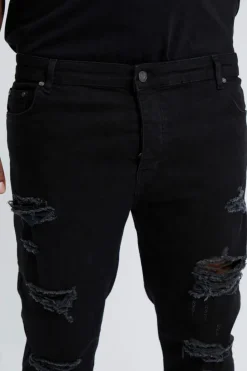 Shop boohooMAN Plus Skinny Stretch All Over Rip Jeans true black