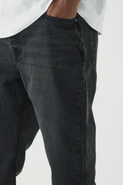 Store boohooMAN Plus Tapered Rigid Jeans washed black