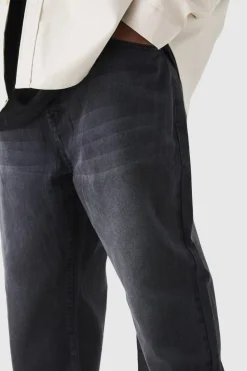 Shop boohooMAN Plus Tapered Rigid Jeans washed black